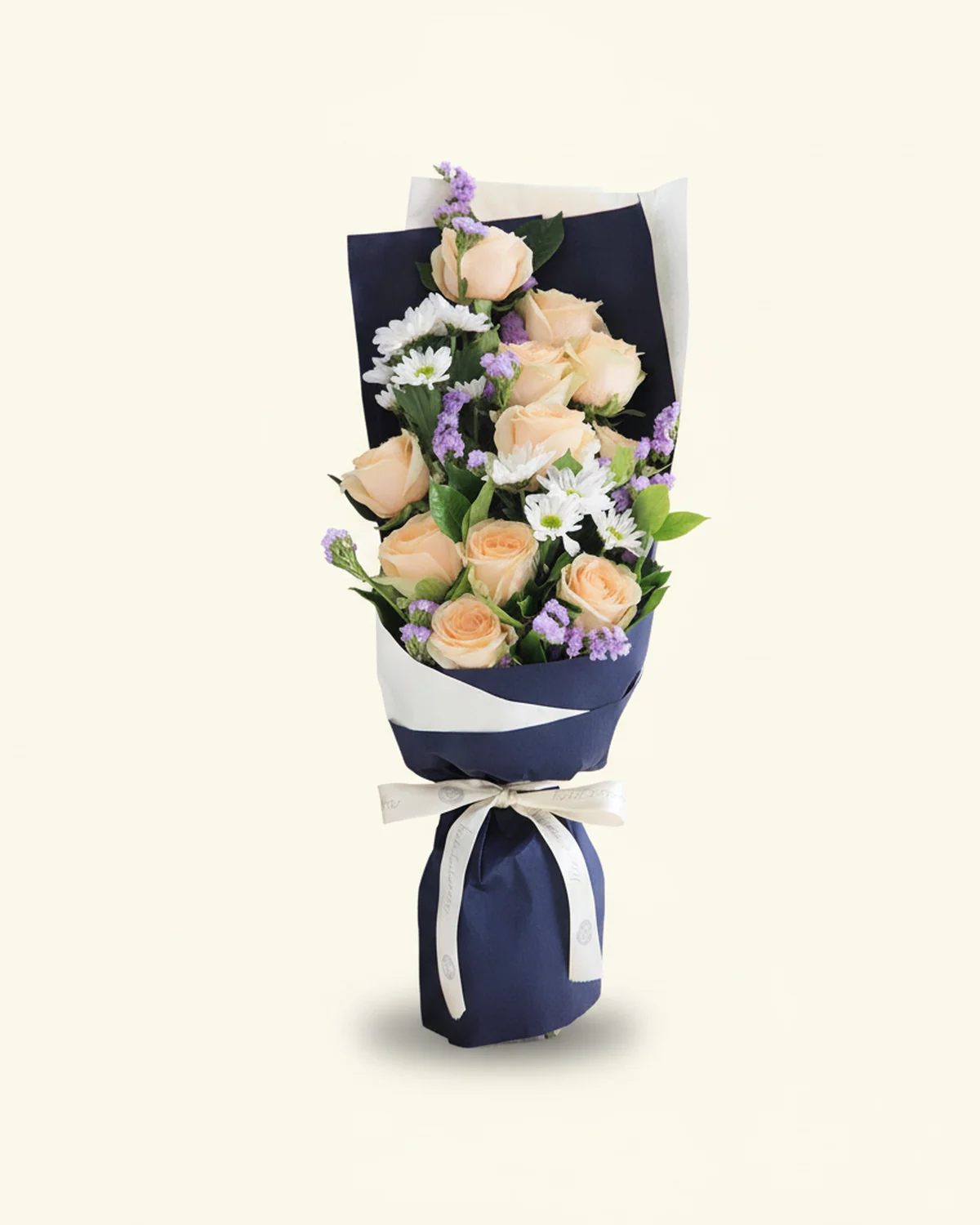 A Single Thought — Elegant Apology Bouquet — 11 champagne roses, 3 white daisies (5–8 heads per stem), 4 light purple forget-me-nots, Gardenia foliage, 2 stems