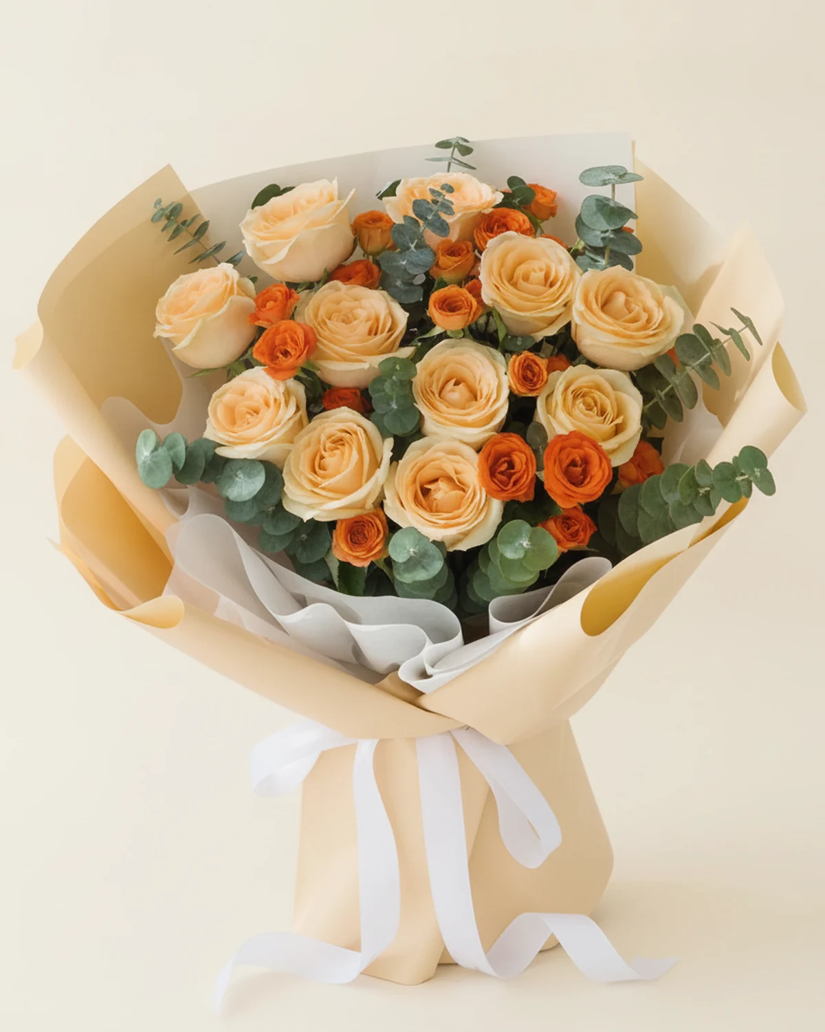 Warm Grace Bouquet — Champagne roses — 11 stems, Orange multi-head 'bubble' — 4 stems (5–8 heads/stem), Eucalyptus foliage — 18 stems