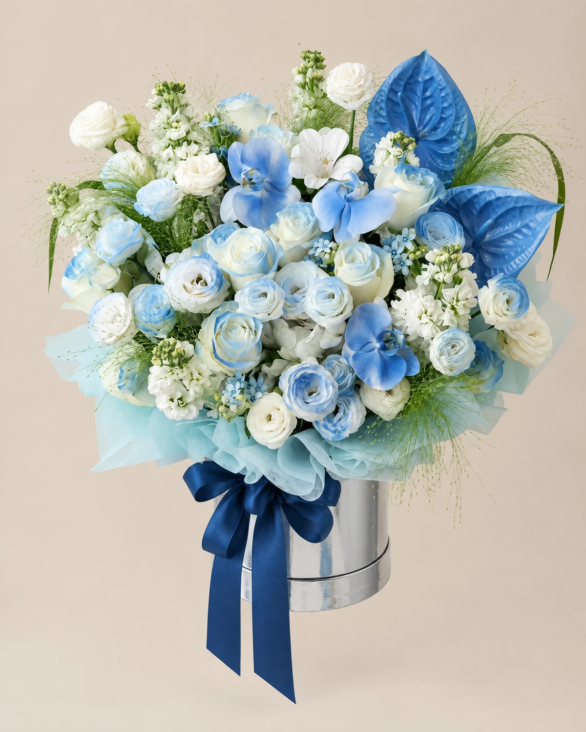 Blue Tribute Flower Bucket — White 'Pride' roses — 11 stems (sprayed light blue), White Liuchu flowers — 3 stems, White stock flowers — 6 stems, White moth orchids — 3 blooms (sprayed light blue), Anthuriums, 2 stems, Fountain grass — 7 stems, White eustoma — 6 stems (4 heads/stem, sprayed light blue), Blue star flowers — 4 stems