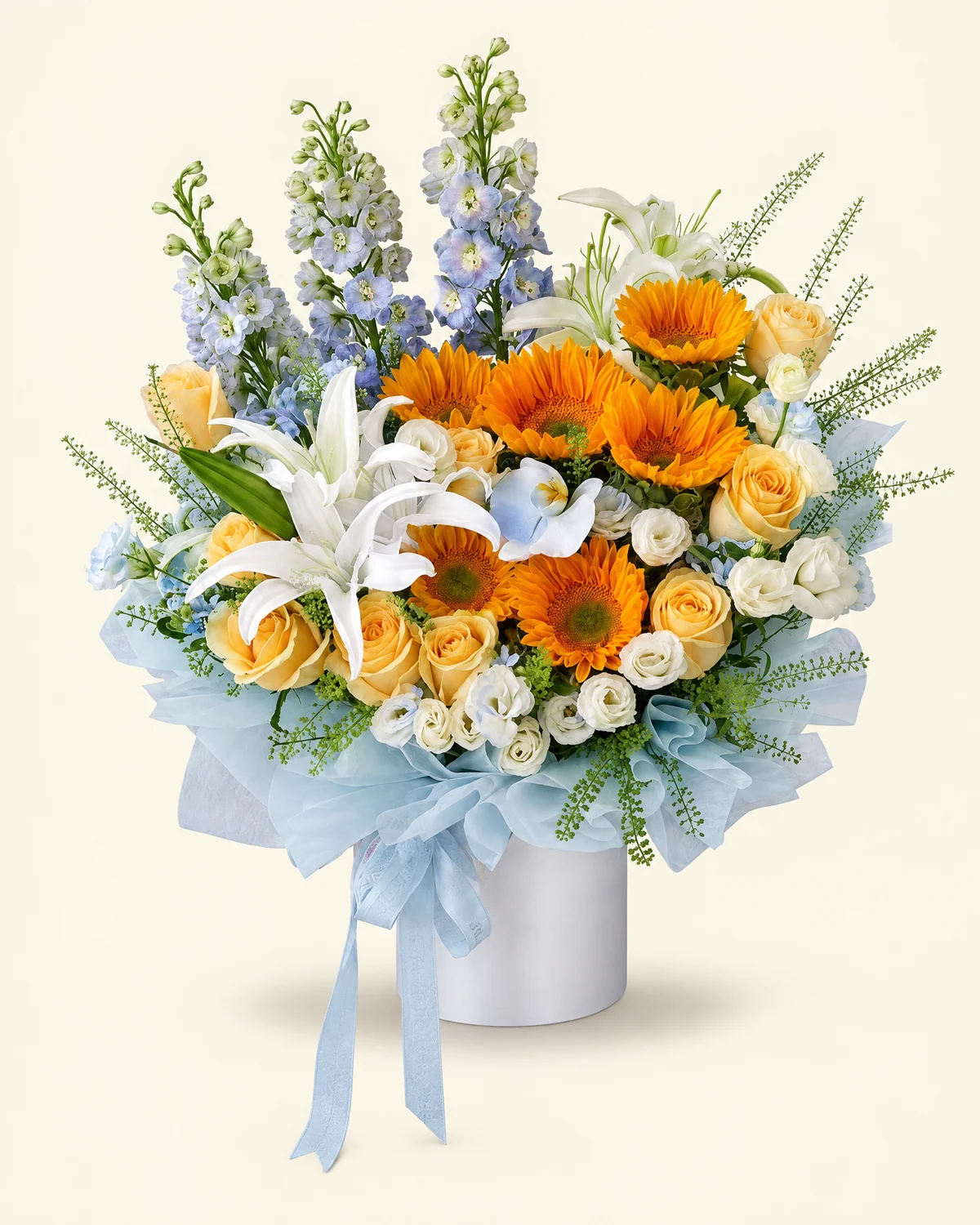 Blue Sun Warmth Bouquet — Green-centered sunflowers — 6 stems, Blue delphinium — 3 stems, White fragrant lilies — 2 stems (5 heads/stem), Champagne roses — 9 stems, White moth orchid — 1 bloom (sprayed light blue), Blue star flowers — 3 stems, White multi-head eustoma — 5 stems (5 heads/stem, some sprayed light blue), Green Trick dianthus — about 10 multi-head stems