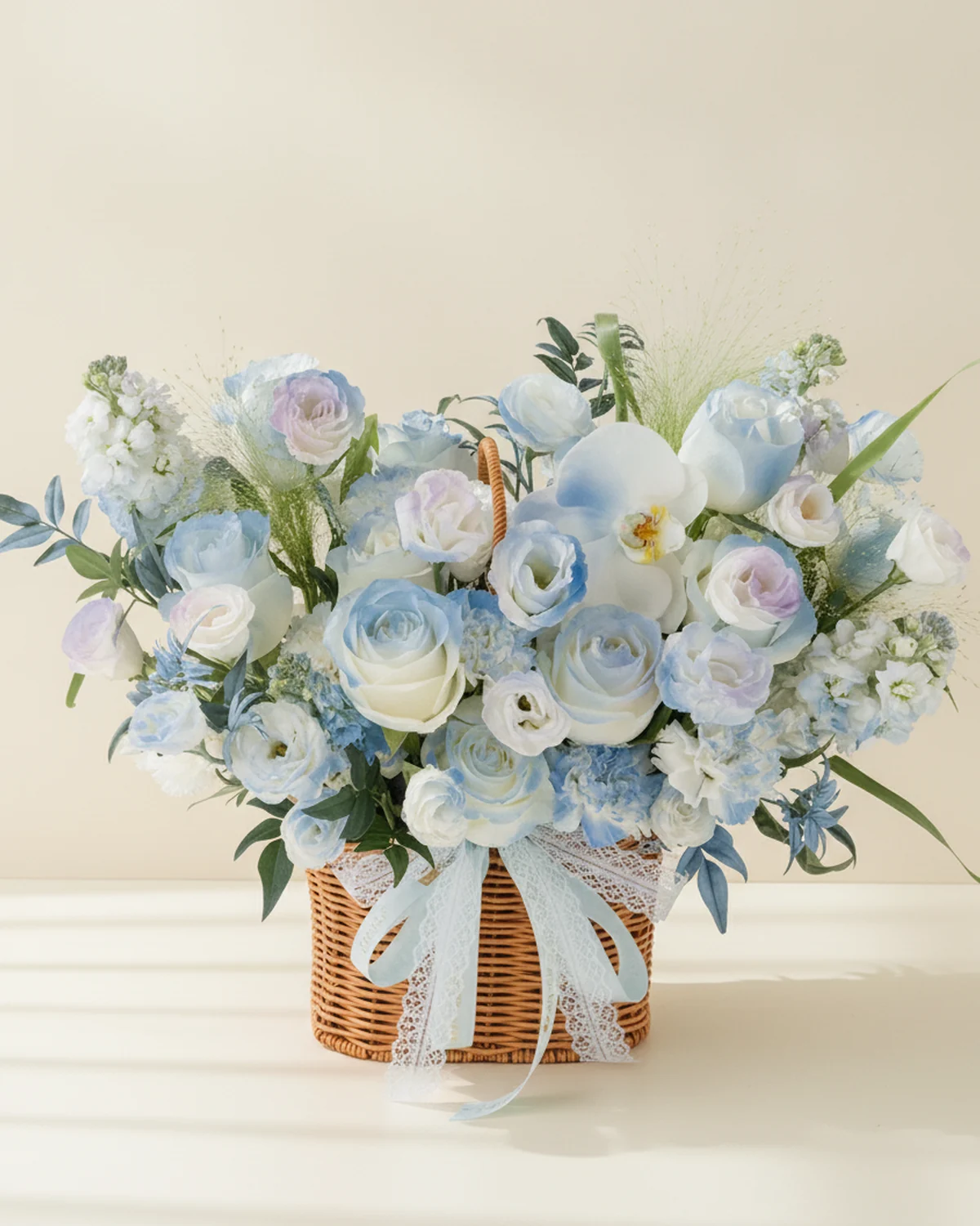 Blue Dream Constellation Bouquet — White 'Pride' roses — 11 stems (sprayed light blue), White moth orchid — 1 bloom (sprayed light blue), Fountain grass — 3 stems, White stock flowers — 4 stems (sprayed blue-purple), White eustoma — 6 stems (4 heads/stem, sprayed blue-purple), White carnations — 11 stems (sprayed blue), Jiuxing foliage — 7 stems (sprayed blue)