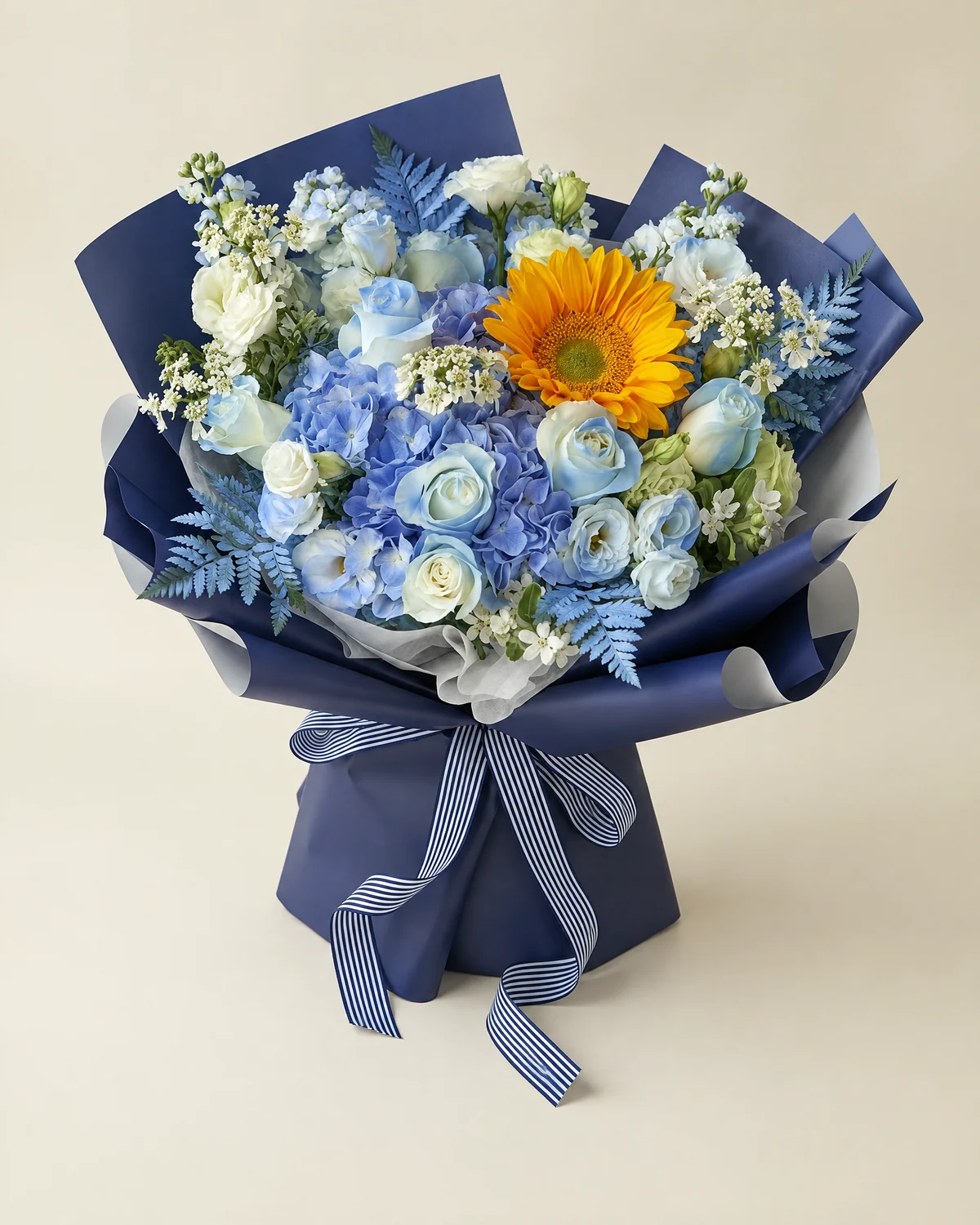 Blue Guardian Bouquet — Light-blue hydrangea — 1 stem, Green-centered sunflower — 1 stem, White roses (sprayed light blue) — 8 stems, White lisianthus — 5 stems (3+ heads per stem), Green lisianthus — 3 stems (3+ heads per stem), White stock flowers (sprayed light blue) — 4 stems, White filler 'feixiang' (bridal lace — 4 stems; white blue-star flowers — 2 stems; mountain fern — 4 stems, sprayed blue)
