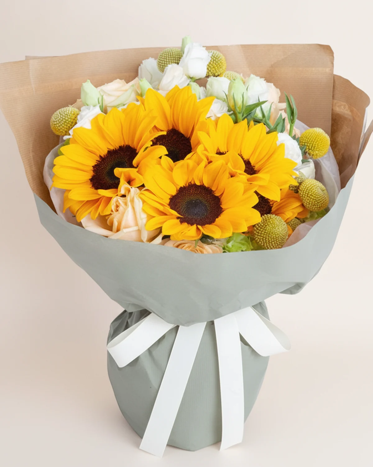 Summer Glow Sunflower Bouquet — A-grade sunflowers, 4 heads, Craspedia (billy balls), 6 stems, A-grade champagne roses, 10 stems, White lisianthus, 3 stems, Green carnations, 5 stems