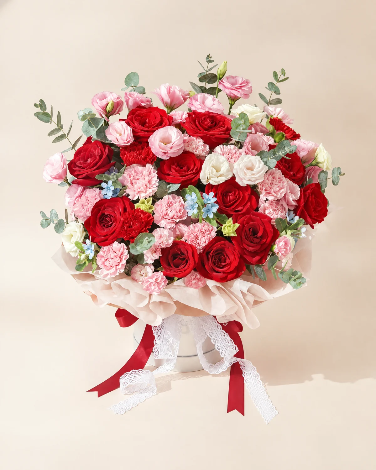 Dad’s Moments of Joy Bouquet — Red roses, 11 stems, Blue star flowers, 3 stems, Light pink lisianthus, 6 stems (multi-head, 3+ heads per stem), Pink multi-head carnations, 3 stems (4+ heads per stem), Pink carnations, 11 stems, Red carnations, 3 stems, Large-leaf eucalyptus foliage, 15 stems