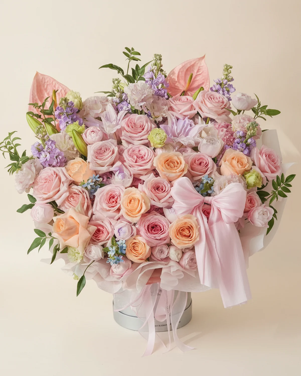 Gentle Guardian Bouquet — 15 lychee-pink roses, 7 champagne roses, 1 pink hydrangea, 2 pink double-headed lilies (3+ heads per stem, sprayed purple), Pink anthuriums, 2 stems, 6 purple stock flowers, 4 pink spray roses (3+ heads per stem), 3 blue star flowers, 4 pink ruffled eustoma (3+ heads per stem), Nine-star foliage, 7 stems, 1 large 19.5 cm hug bucket