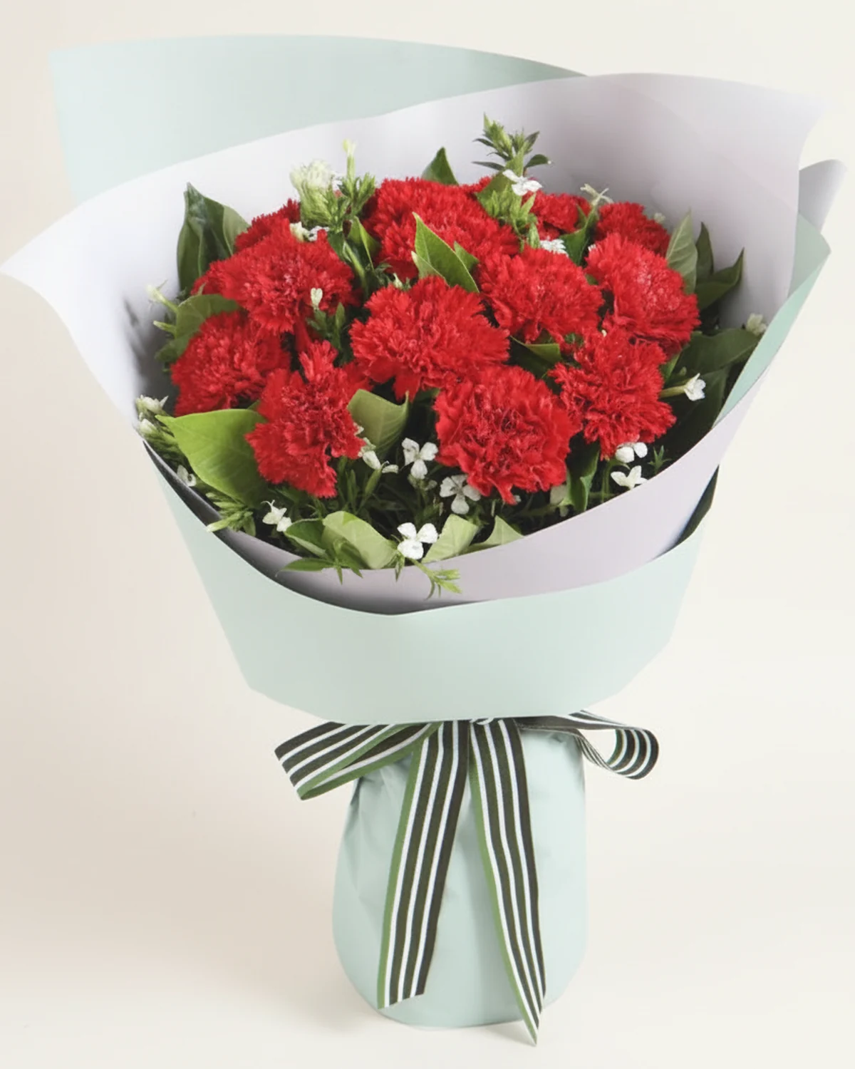 Red Carnation & White Waxflower Bouquet — Red carnations, 12 stems, White waxflower, 2 stems, Gardenia foliage, 5 stems