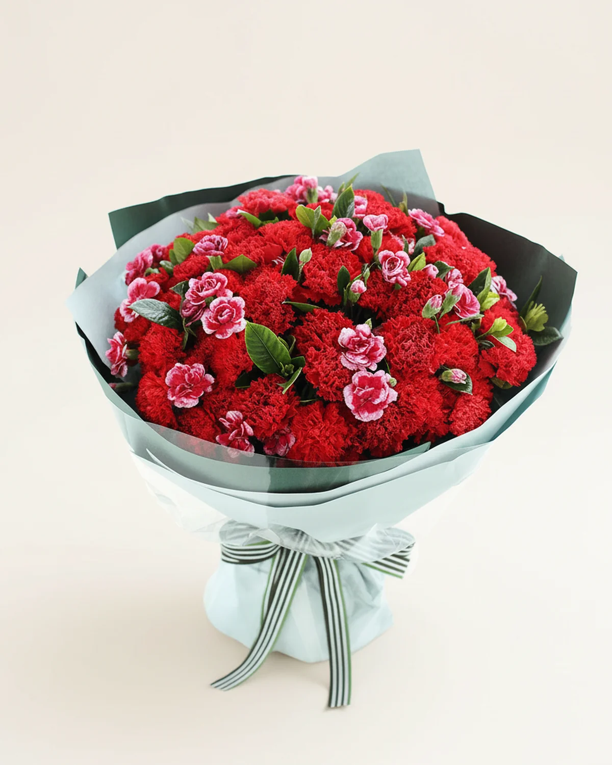 Abundant Father's Tribute — Red & Purple Carnation Bouquet — 66 red carnations, 15 multi-headed purple carnations with white edges, Gardenia foliage