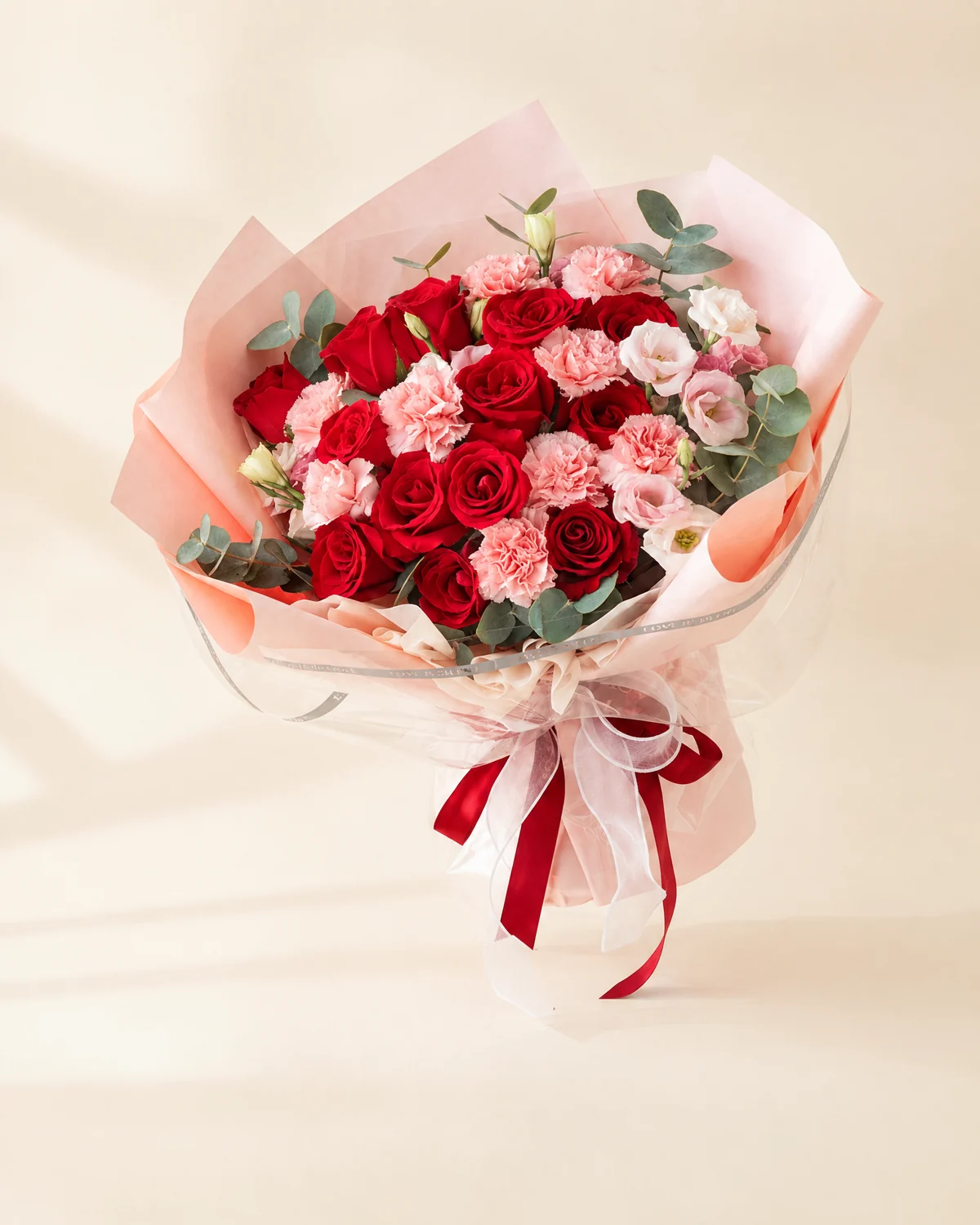 Heartfelt for Dad — Carnations & Roses Bouquet — 9 pink carnations, 13 red roses, 4 pink lisianthus stems (3+ heads per stem), 10 eucalyptus stems