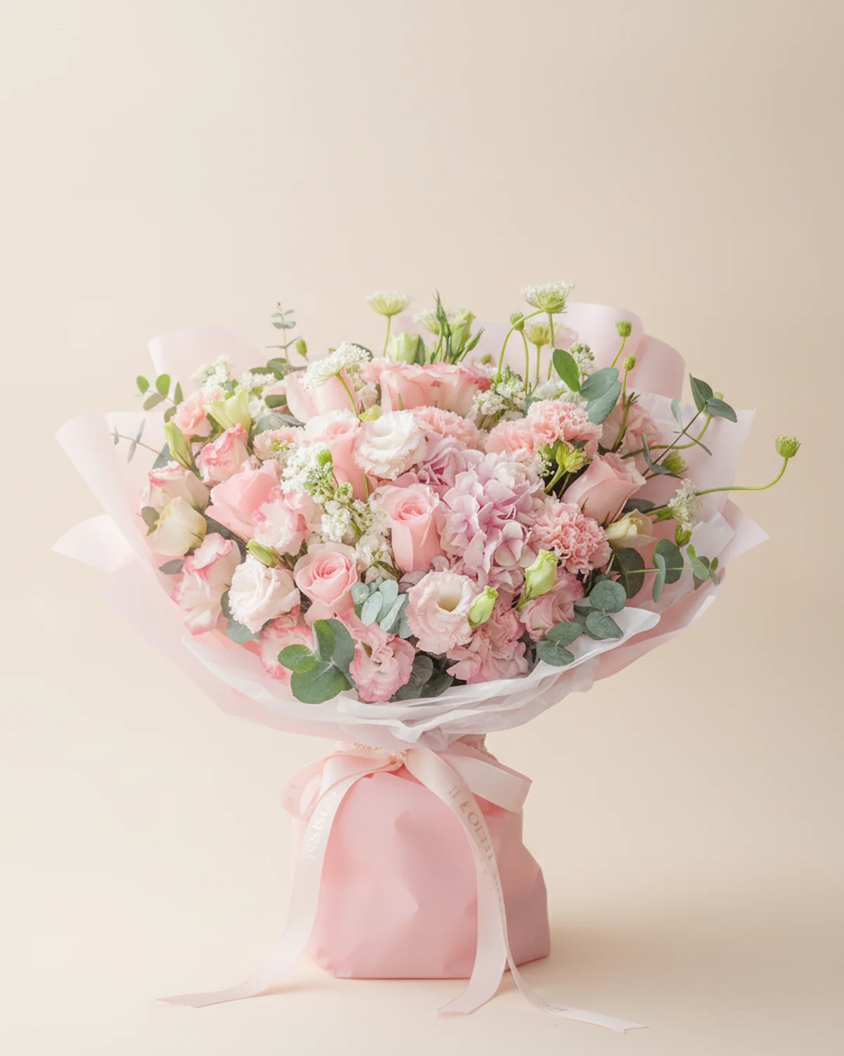 Soft Pink Hydrangea Garden Bouquet — Pink carnations, 11 stems, Pink Jia Ren roses, 5 stems, White lisianthus with pink edges, 5 stems, Pink hydrangea, 1 stem, White stock, 5 stems, White lace flower, 3 stems, Eucalyptus, 5 stems