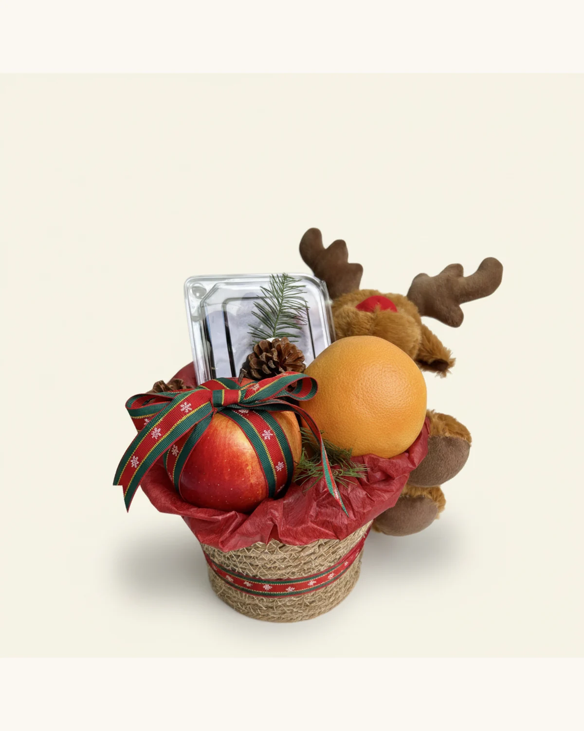 Christmas Reindeer Fruit Gift Basket — Red Apple, Orange, Cherries, Christmas Reindeer Plush, Pine Cone, Christmas Ribbon, Woven Basket, Red Wrapping Paper