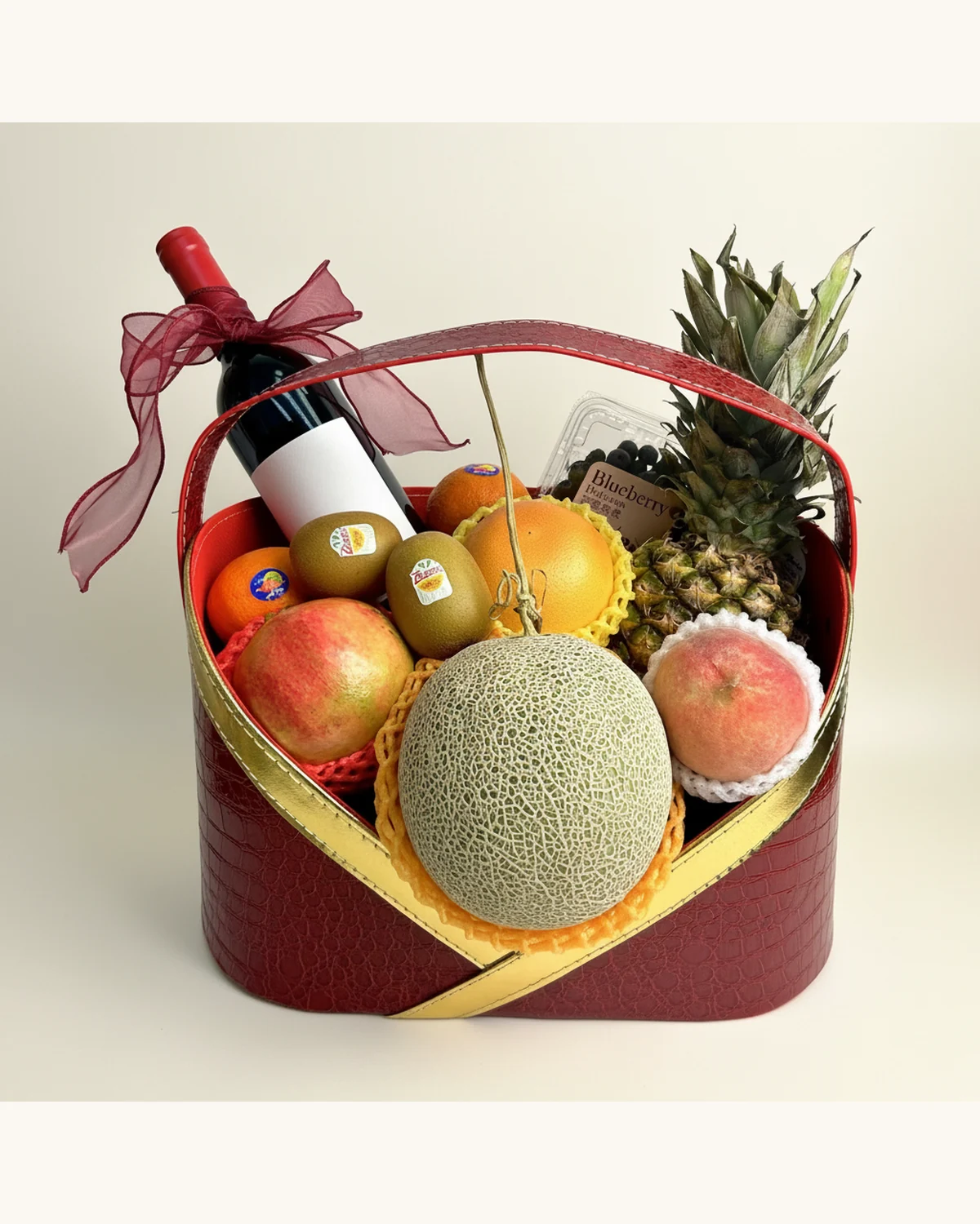 Red Wine & Fresh Fruit Gift Basket — Red Wine, Musk Melon, Pineapple, Peach, Kiwi Fruit, Red Pomelo, Mandarin Orange, Blueberries, Red Heart-Shaped Leather Basket