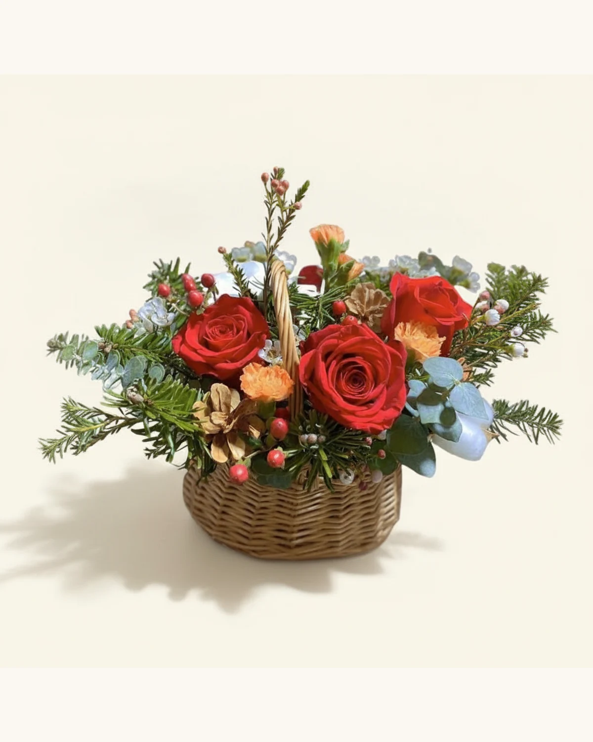 Red Rose & Pine Cone Christmas Flower Basket — Red Roses, Orange Roses, Pine Cones, Pine Foliage, Holly Berries, Eucalyptus, Woven Wicker Basket