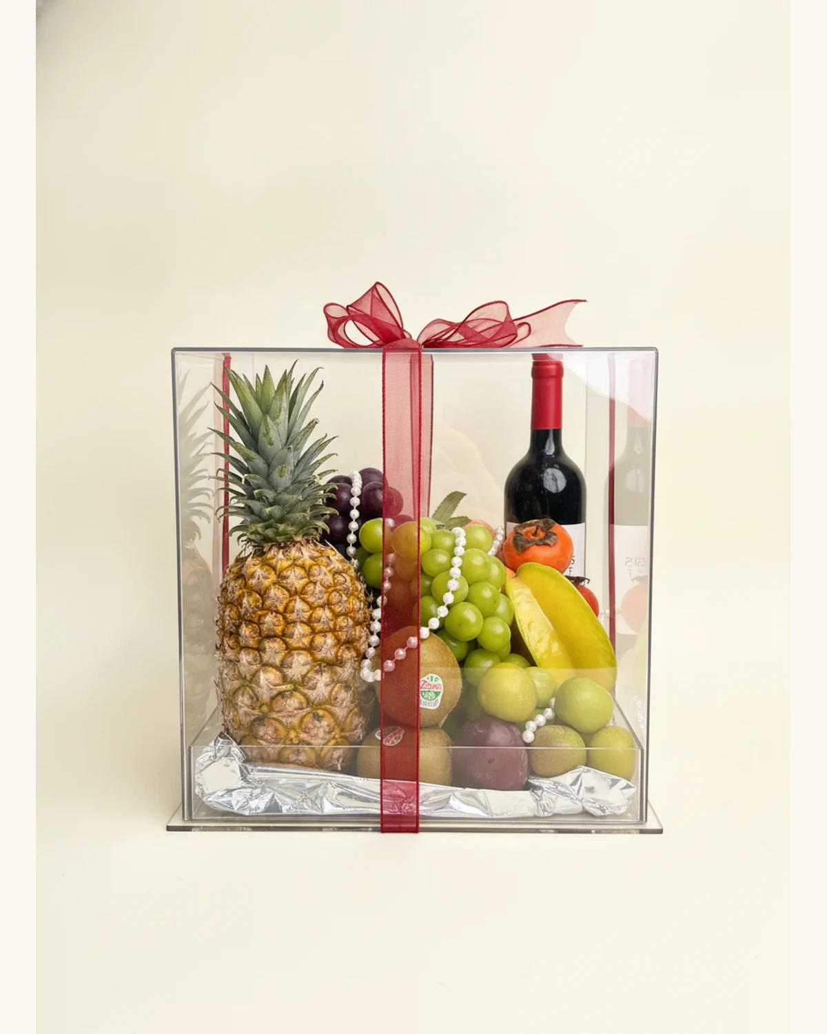 Christmas Wine & Fruit Acrylic Gift Box — Red Wine, Pineapple, Shine Muscat Grapes, Black Grapes, Starfruit, Kiwi Fruit, Persimmon, Plums, Pearl Chain Decoration, Red Ribbon, Acrylic Gift Box