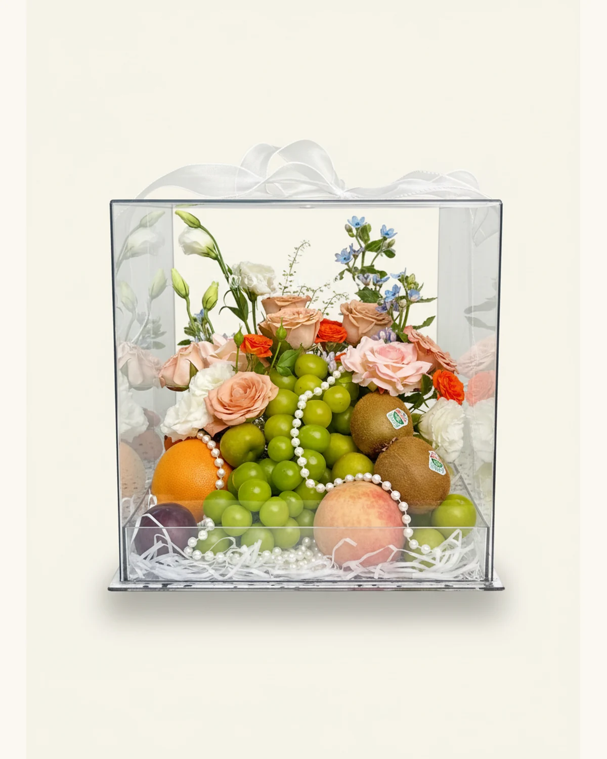 A Midsummer Night's Dream Floral & Fruit Acrylic Gift Box — Shine Muscat Grapes, Peach, Kiwi Fruit, Plum, Sweet Orange, Greengage, Pink Rose, Cappuccino Rose, Spray Rose, Oxypetalum, Eustoma, Pearl Chain Accessory, Acrylic Gift Box, White Ribbon