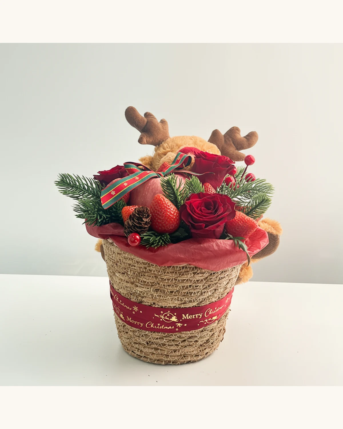 Christmas Reindeer Floral & Fruit Gift Basket — Red Roses, Nobilis Fir, Strawberries, Red Apple, Reindeer Plush Toy, Woven Basket, Pine Cone, Red Berries, Christmas Ribbon