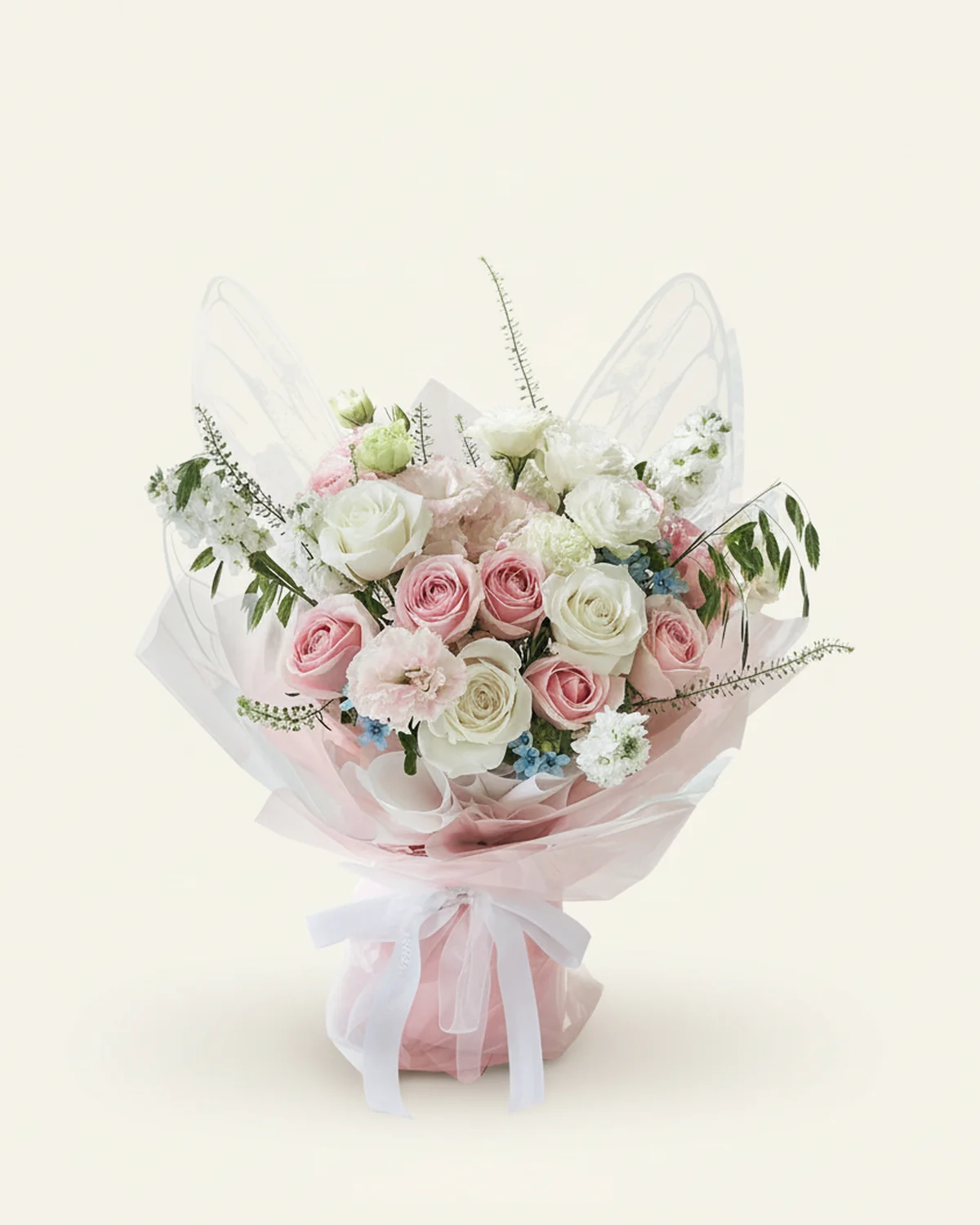 Blushing Butterfly — White roses ('Pride') — 4 stems, Pink roses — 7 stems, Pink ruffled lisianthus — 4 stems (multi-headed, 3+ heads per stem), Blue star flower — 2 stems, Ornamental grass, 2 stems, Green Trick dianthus, 6 stems, White violets — 3 stems