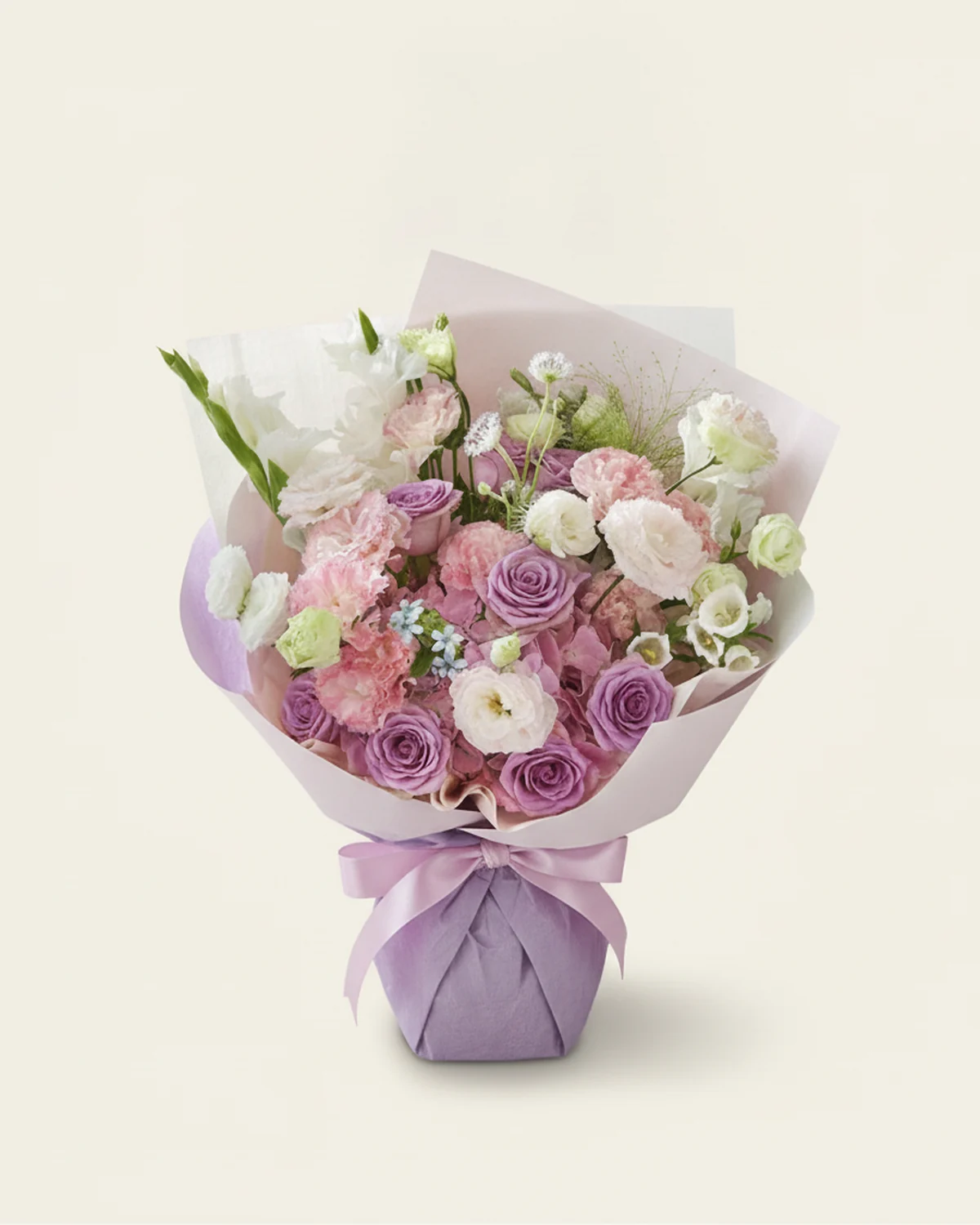 Violet Guardians Bouquet — 9 purple roses, 1 blue starflower, 2 stems multi-headed white lisianthus (each 3+ heads), 3 stems multi-headed green lisianthus (each 3+ heads), 4 stems multi-headed pink-edged sunshine lisianthus (each 3+ heads), 3 white gladiolus stems, 1 stem fountain grass, Purple trachelium, 1 stem, 1 pink hydrangea stem, 2 white bellflower stems